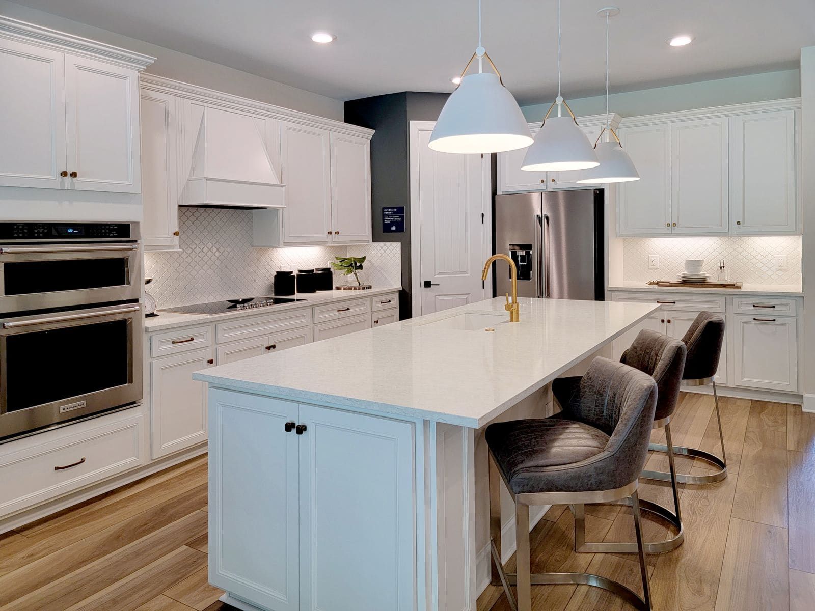 Bright white modern kitchen with well-maintained quartz countertops